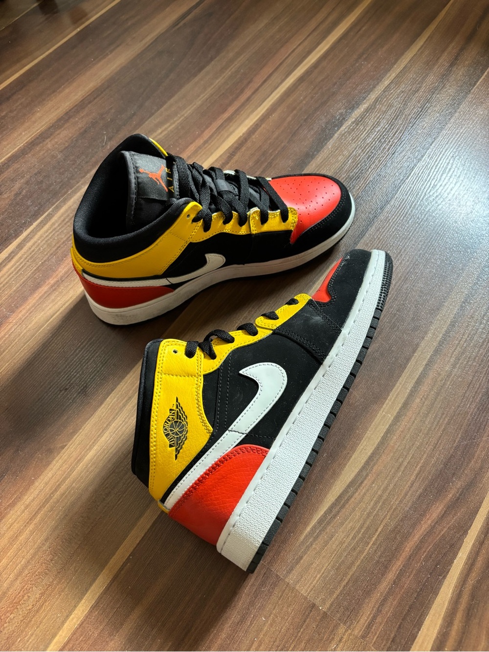 Nike Air Jordan 1 Mid-Rise Sneakers in Black, Yellow, Orange, White
